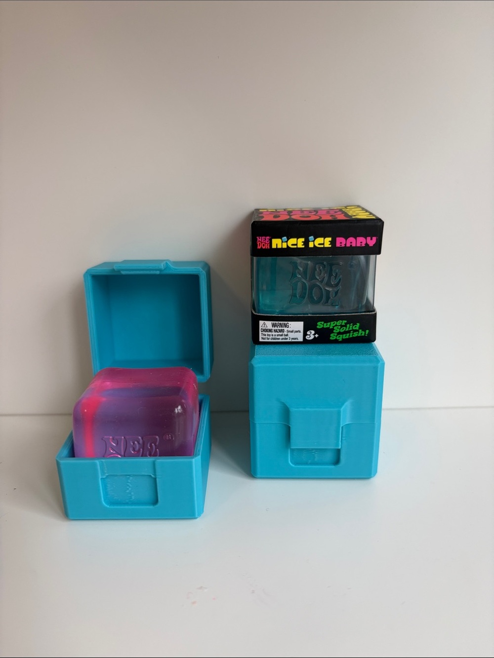 2 Schylling Needoh Nice Ice Baby Squishy Cube with Blue Case - Pink & Blue.NEW